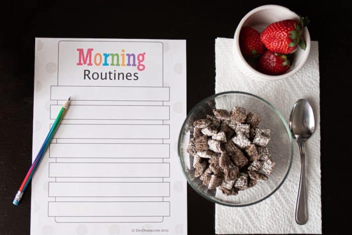 Morning Routine chart for kids on table with breakfast before school.