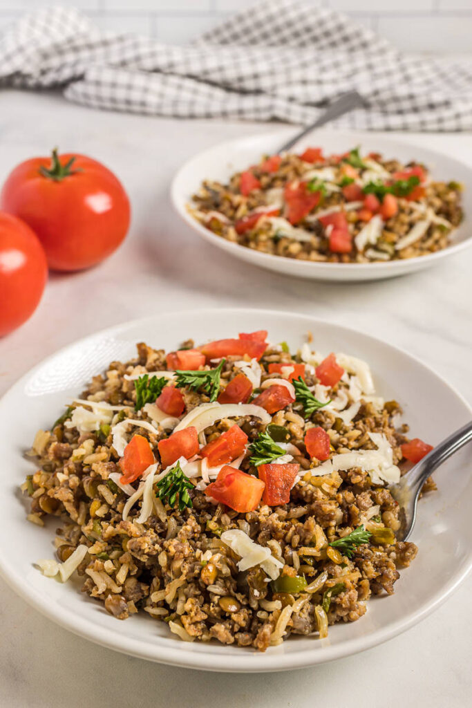 Sausage, Lentil and Rice skillet meal on white plates